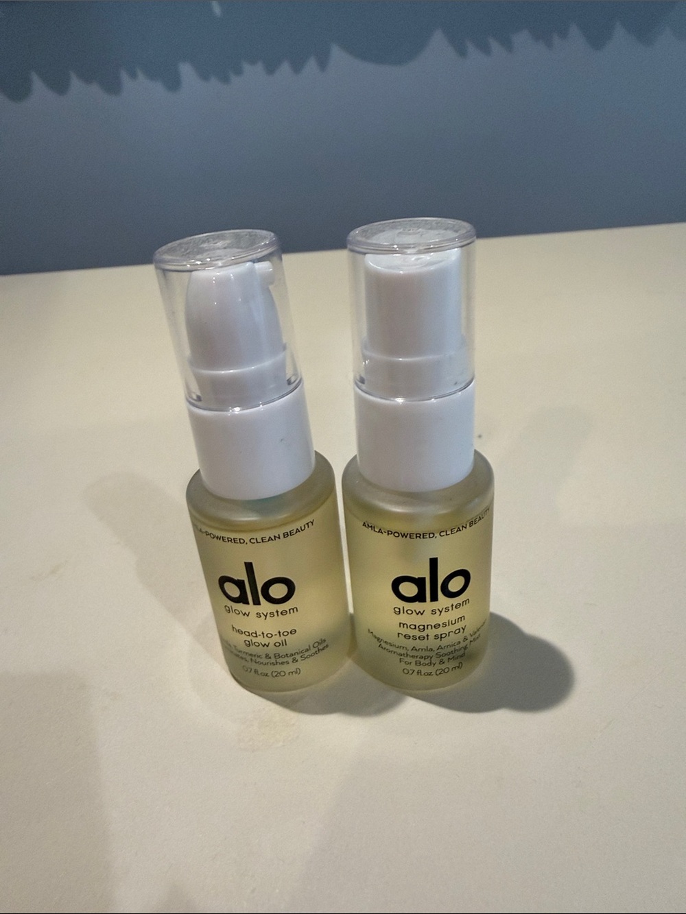 ALO Yoga glow system duo - white and clear pump bottles